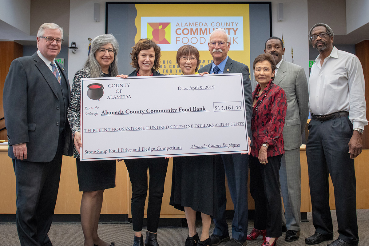 Our Board of Supervisors and County Administrator presented Alameda County Community Food Bank with a $13,161 check to culminate the Stone Soup Food Drive.