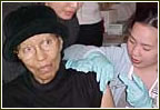 Picture of a woman getting vaccinated.
