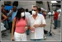 Picture of two people wearing masks.