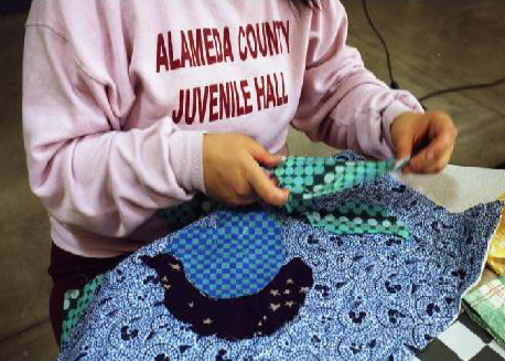 youth working on a quilt