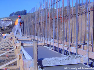 Photo of a construction worker working with rebar.